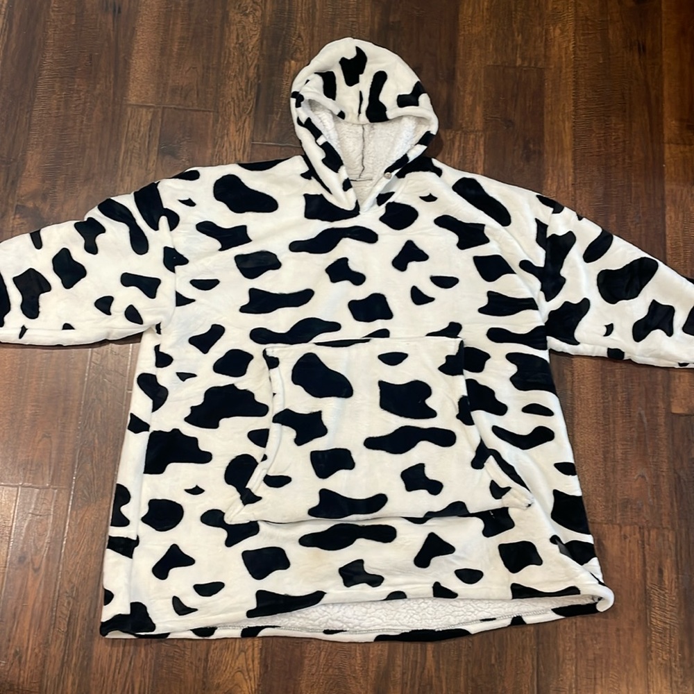 Cow print fleece/sherpa wearable blanket, one size fits most.